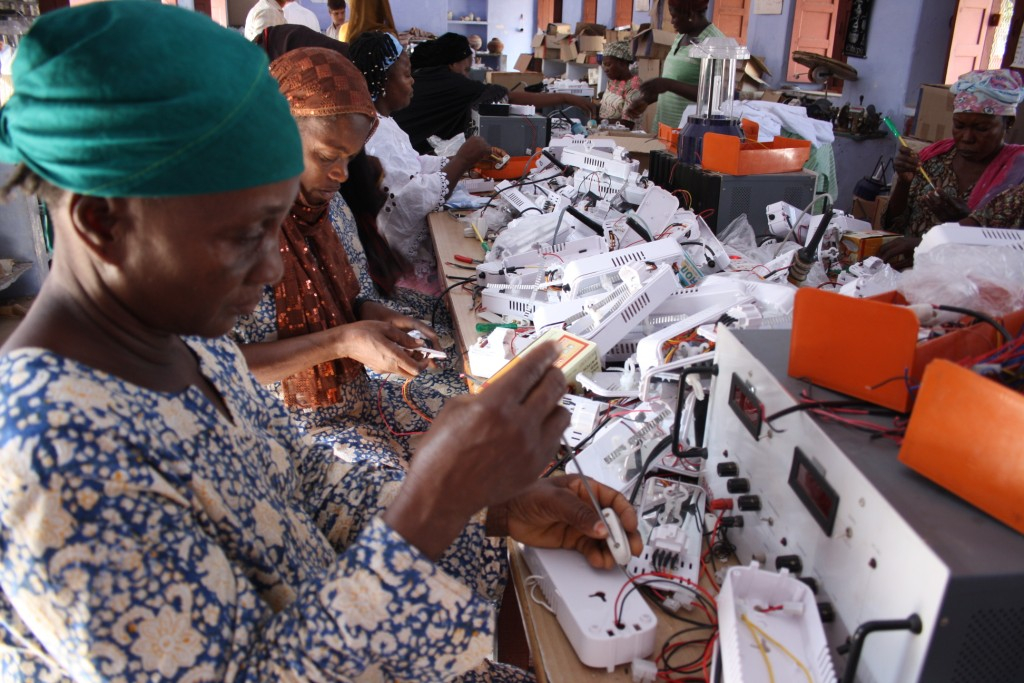 women working with electrical components