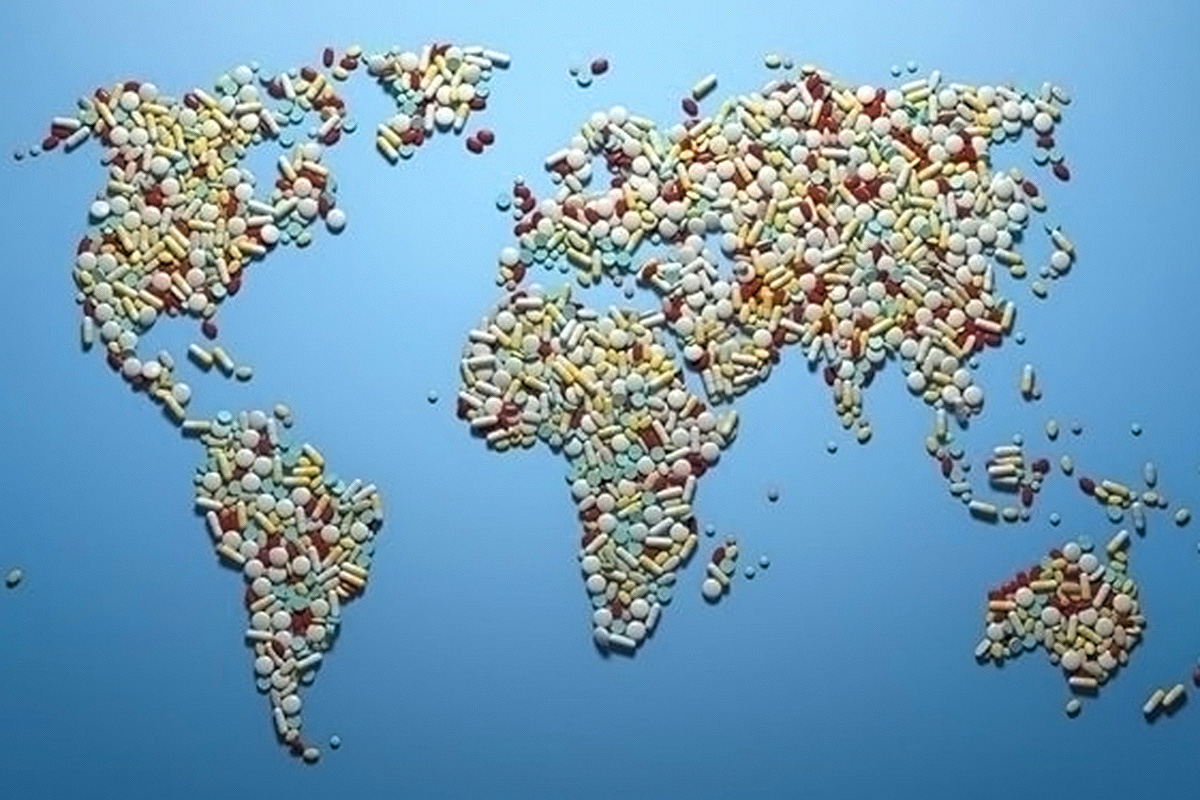 The world map shaped by pills of different sizes and colours.